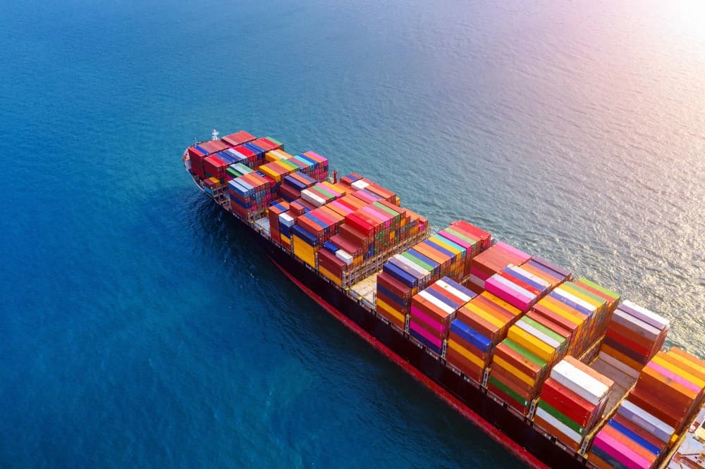 Shipping containers being loaded at port